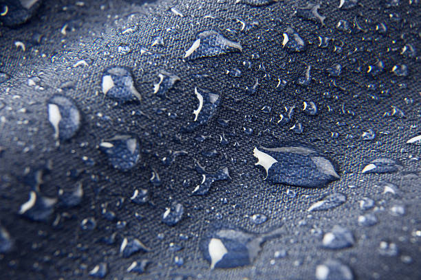 fondo azul, membrana impermeable textil - impermeable fotografías e imágenes de stock