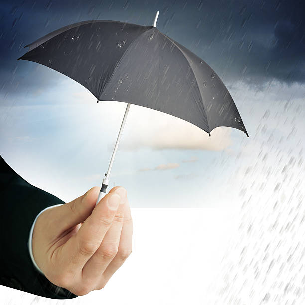 istock Human hand holding an umbrella 468726496