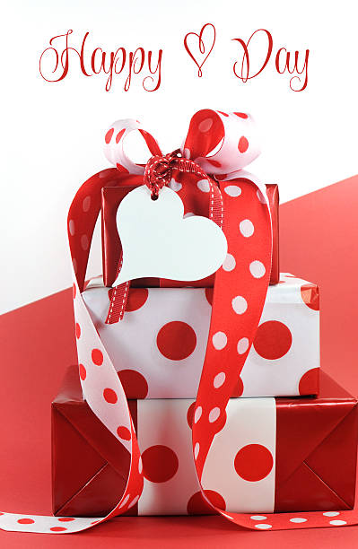 istock Polka dot decorated gifts on red and white background 468727377