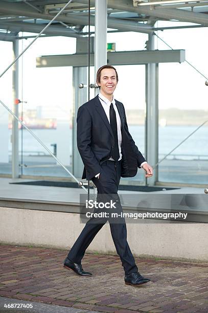 Portrait Of A Handsome Young Businessman Walking In The City Stock Photo - Download Image Now