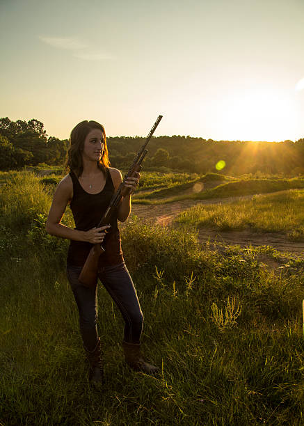 istock Lady Holds Shotgun 468730447