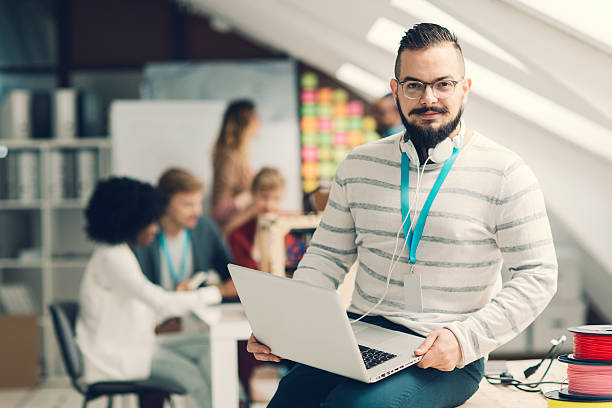 istock Confident male executive stand out in front of his team. 468730762