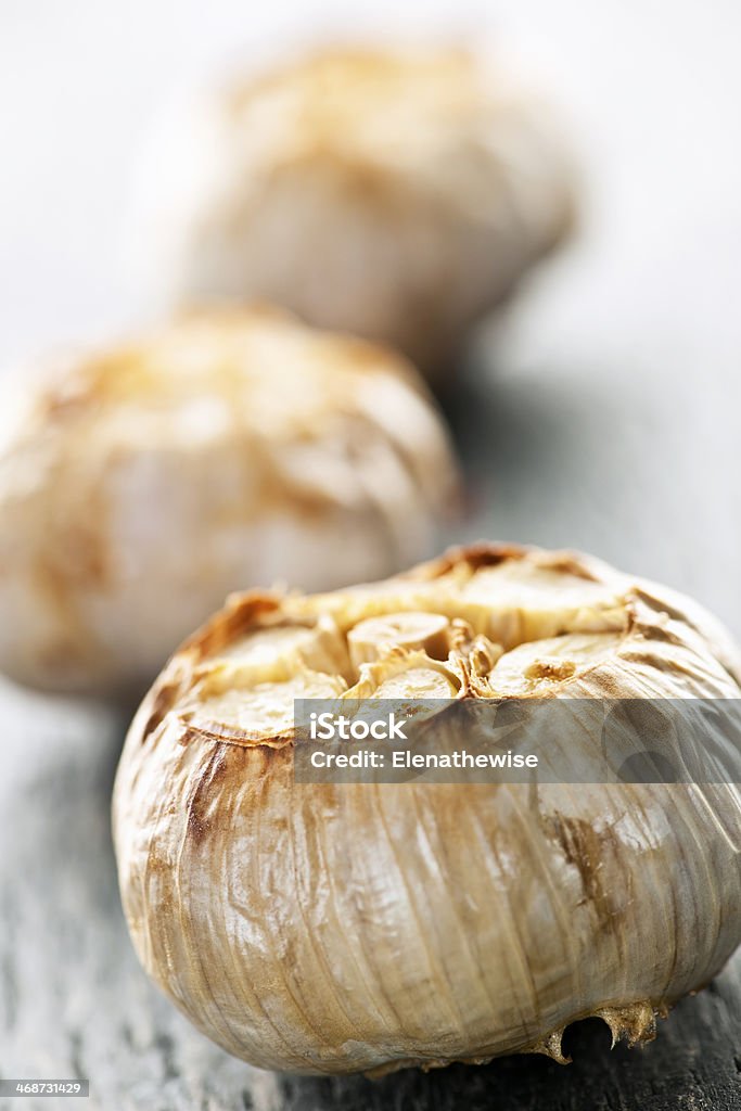 Roasted garlic bulbs Close up of fresh roasted garlic bulbs Close-up Stock Photo