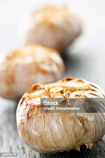 Roasted Garlic Bulbs Stock Photo - Download Image Now - Close-up, Cooked, Extreme Close-Up