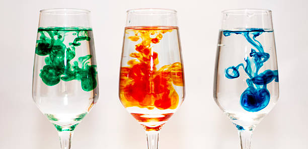 Three glasses filled with water and food colourings Three glasses filled with water and food colourings food coloring stock pictures, royalty-free photos & images