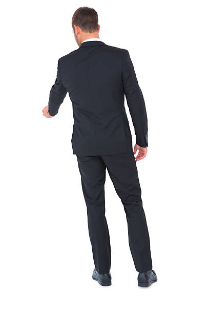 istock Businessman standing and looking down 468733304