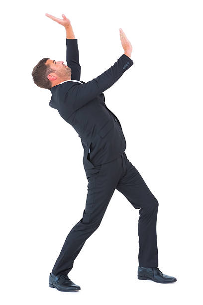 istock Businessman bending and pushing 468733494