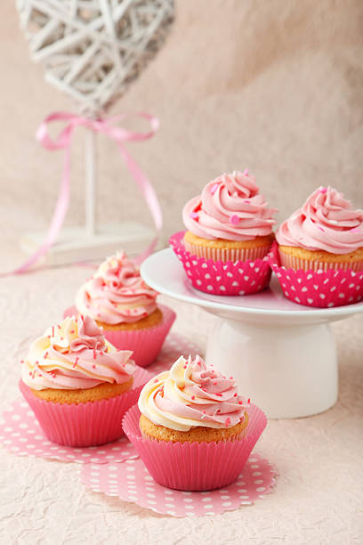 istock Tasty cupcake on pink background 468733552