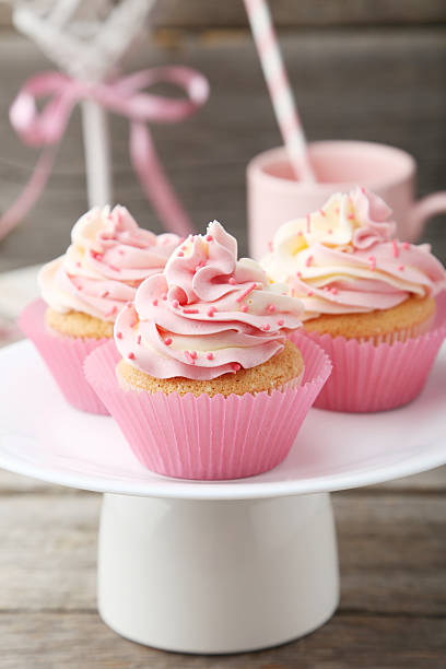 istock Tasty cupcake on grey wooden background 468733558