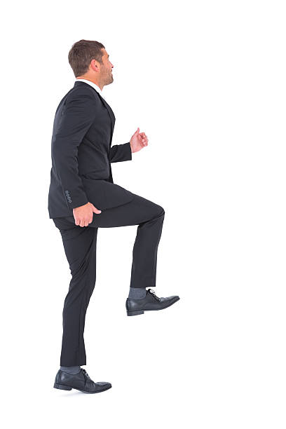 istock Businessman walking with his leg up 468733772