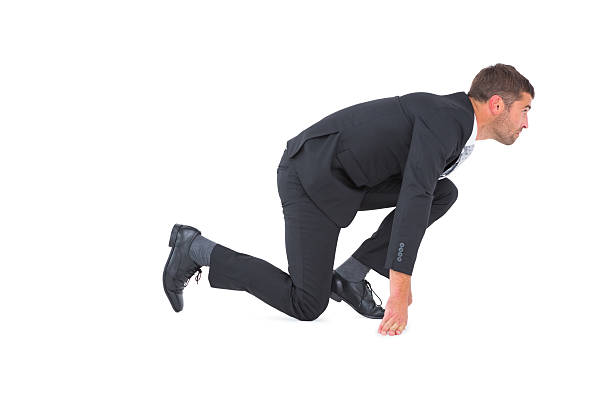 istock Concentrate businessman crouching waiting for the start 468733794