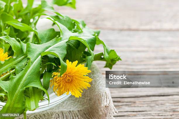 Dandelions Greens And Flowers Stock Photo - Download Image Now - Bowl, Copy Space, Dandelion