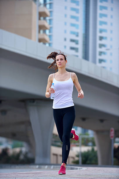 istock woman jogging at morning 468736217