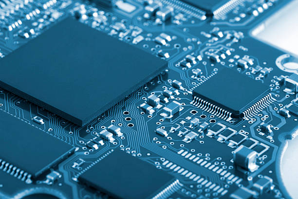 Blue toned circuit board detail stock photo