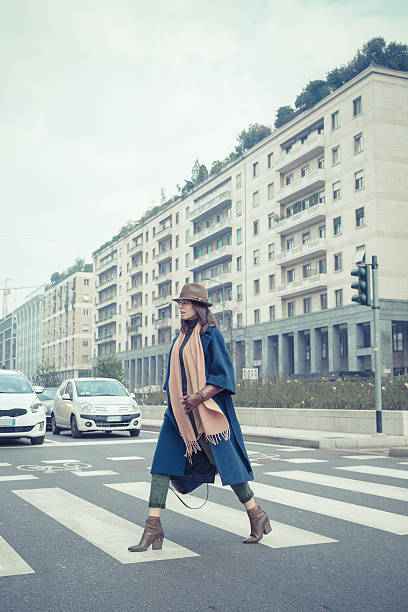 istock Beautiful young brunette posing in the city streets 468737228