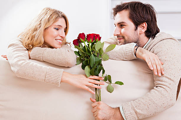 istock Beautiful couple holding roses 468740523