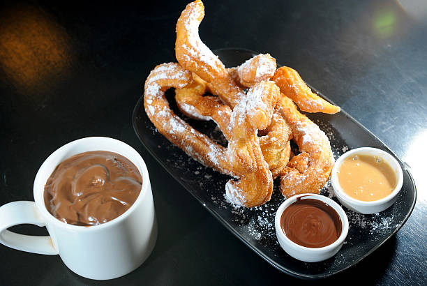 istock churros chocolate, a typical Spanish sweet snack 468740745