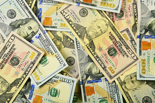 istock Group of fifty and one hundred dollars 468744340