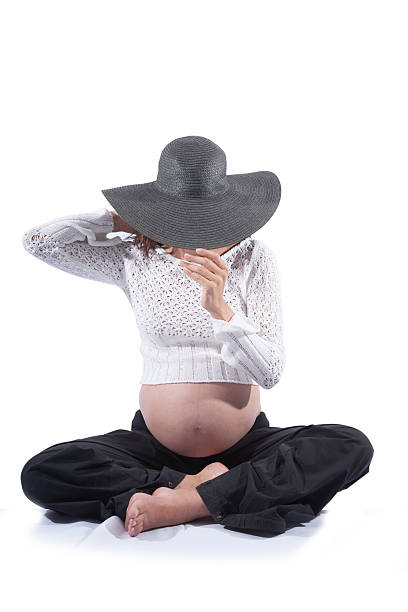 istock sitting pregnant hidden face 468747756
