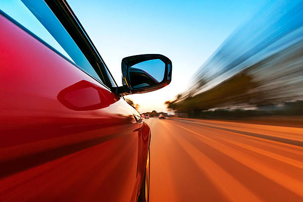 istock A red sports car driving quickly 468748331