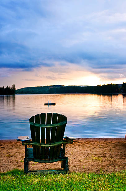 istock Wooden chair at sunset on beach 468748633