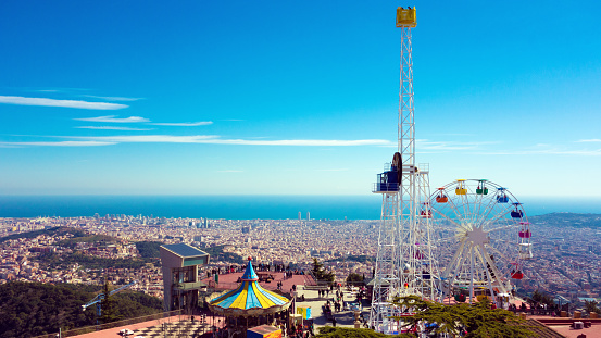 Looking at Barcelona from Mount Tibidabo with the famous amusement park in the front. The access to Tibidabo is free, so there is no charge of an admission fee and you do not require a ticket for entry.