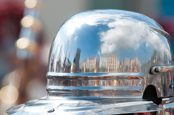 Reflection of the buildings of Santander through a Roman helmet.
