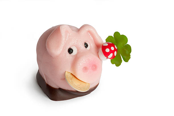 istock Lucky marzipan pig with cent, cloverleaf and mushroom 468751974