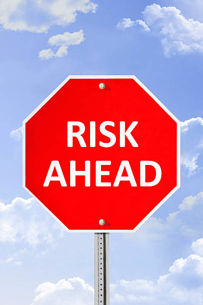 istock Risk Ahead Warning Sign Against Blue Sky 468755408