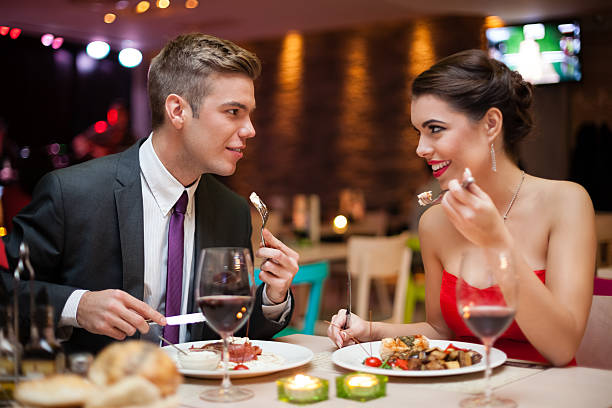 istock man and woman having a romantic meal 468755767