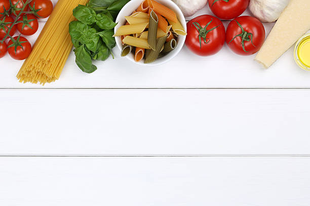 istock Various ingredients for pasta on a white, wooden table 468759276