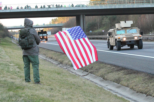 Pilsen, Czech Republic - April 1, 2015: Unidentified Czech citizens cheering up Dragoon Ride convoy from Operation Atlantic Resolve. Longest march US Army in Europe after second world war.