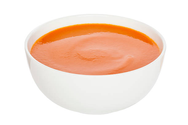 Tomato Soup Cutout Tomato Soup - Cream of Tomato Soup in a white china bowl, clipping path, front to back focus. tomato soup stock pictures, royalty-free photos & images