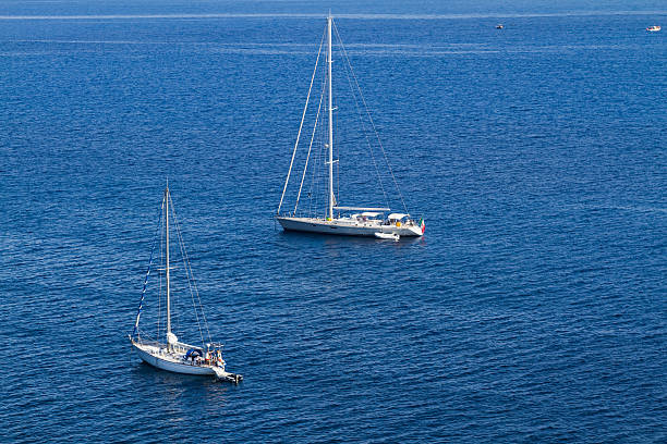 istock boats in the blue sea 468767834