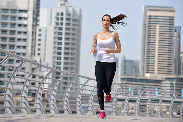 istock woman jogging at morning 468769211