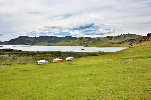 Wide grassland wetland and remote mountain background, taken in Chadan Wetland, Zaduo County, Qinghai Province, China in August 2022