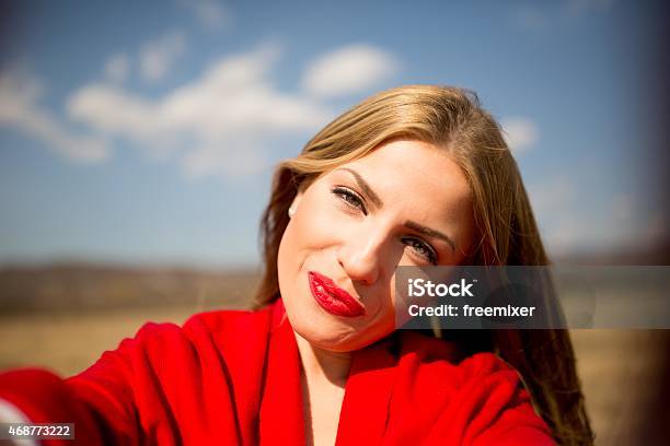 Self Portrait Of Woman In Red Stock Photo - Download Image Now - 2015, Adult, Adults Only