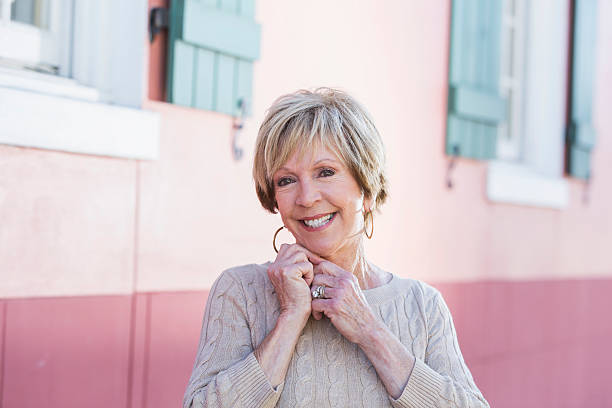 istock Senior woman with short hair smiling 468773302