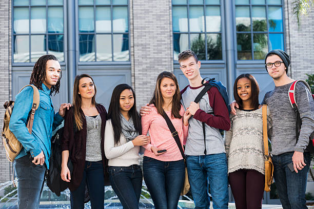 istock Multi-ethnic group of students in a row outside building 468773314
