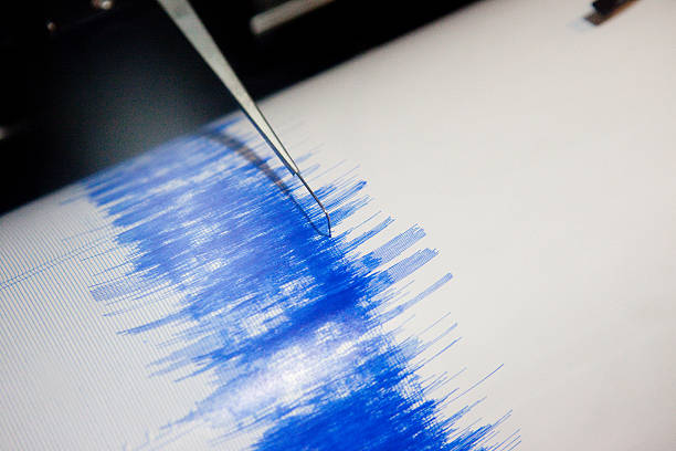 Photo up close of earthquake seismograph in action  stock photo