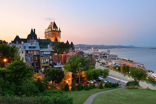 Old buildings in Quebec City at dusk Quebec City skyline with Chateau Frontenac at sunset viewed from hill chateau frontenac hotel stock pictures, royalty-free photos & images