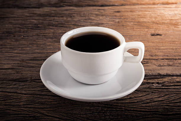 istock Cup of coffee on a wooden table 468786724