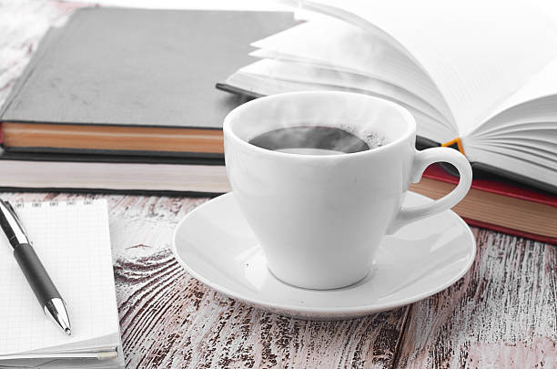 istock Cup of coffee on a wooden table 468786836