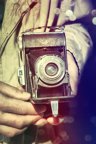 istock Photographer with vintage camera 468786928