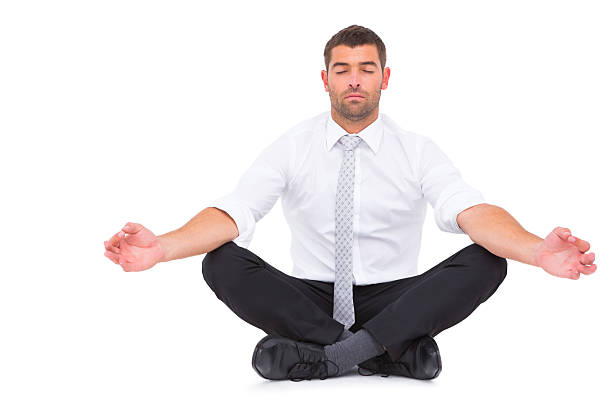 istock Businessman meditating in lotus pose 468789448