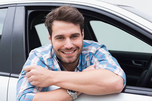 istock Young man smiling and holding key 468791944