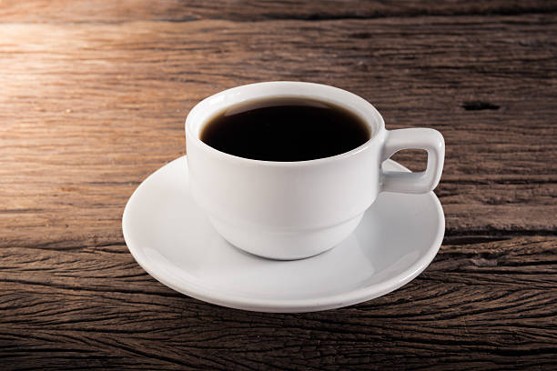 istock Cup of coffee on a wooden table 468794670