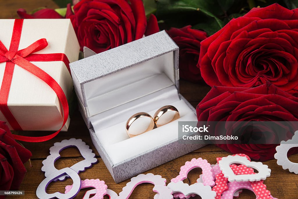 flowers and wedding rings Love background with flowers and wedding rings 2015 Stock Photo