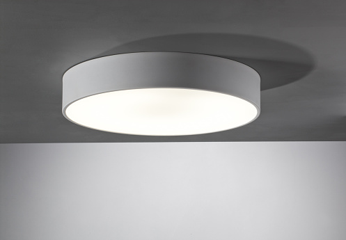 Ceiling mounted light fixture with white walls