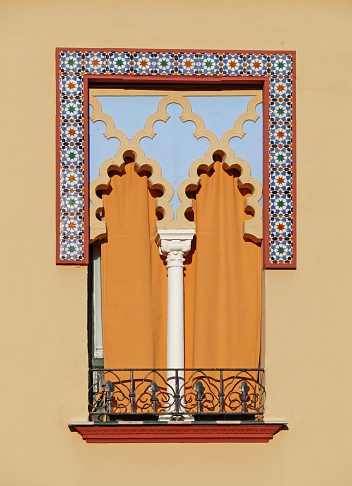 Old window in arabian style in the historic part of Cordoba, Spain